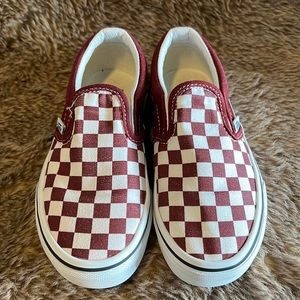 Checkerboard slip on vans.